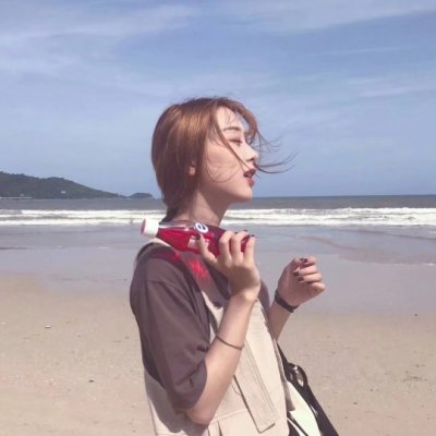 女生海边吹风图片头像_WWW.TQQA.COM