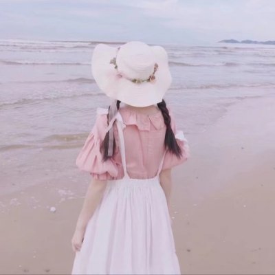 女生海边吹风图片头像_WWW.TQQA.COM